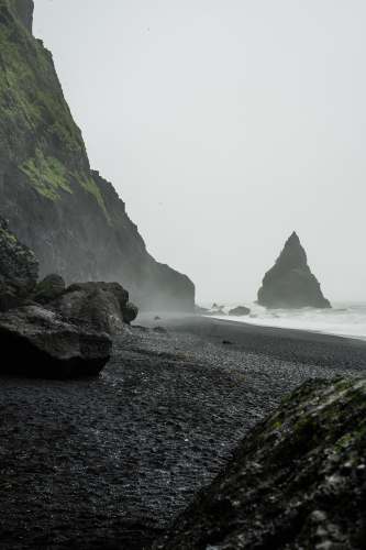 iphone wallpapers landscape photo of black rock formation on body of water near seashore grey